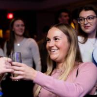Grads cheers at Toast